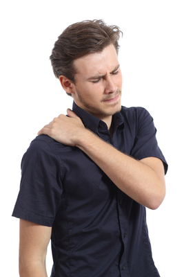 Man with shoulder pain and hand pressing it isolated on a white background